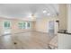 Open floor plan living room features a fan and door to the patio at 4060 Highway 81, Hampton, GA 30228