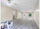 Spacious room features a ceiling fan, updated floors, and large windows at 4060 Highway 81, Hampton, GA 30228