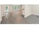 Spacious living room with bright windows, a fan, and a door to the patio at 4060 Highway 81, Hampton, GA 30228