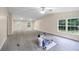 Spacious room features a ceiling fan, updated floors, and large windows at 4060 Highway 81, Hampton, GA 30228