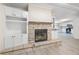 Bright living room with a stone fireplace, built-in shelves, and modern flooring and open floor plan at 4060 Highway 81, Hampton, GA 30228