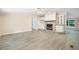 Spacious living room featuring a stone fireplace, built-in shelves, and modern flooring at 4060 Highway 81, Hampton, GA 30228