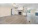 Inviting living room with stone fireplace and built-in storage, flowing into an adjacent kitchen at 4060 Highway 81, Hampton, GA 30228