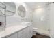 Modern bathroom featuring a glass-enclosed shower, stylish vanity, and sleek, round mirrors at 505 Stedford Lane, Duluth, GA 30097