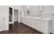 Bright bathroom with dual sinks, modern fixtures, vanity and large mirror at 505 Stedford Lane, Duluth, GA 30097