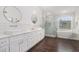 Elegant bathroom features dual sinks, white vanities, soaking tub, and glass-enclosed shower at 505 Stedford Lane, Duluth, GA 30097