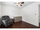 Neat bedroom design, showcasing wooden floors, comfortable seating, and smart storage solutions at 505 Stedford Lane, Duluth, GA 30097