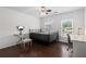 Well-lit bedroom featuring dark wood floors and a vanity set by the window at 505 Stedford Lane, Duluth, GA 30097