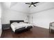 This well-lit bedroom includes wood floors, a tray ceiling, and neutral décor at 505 Stedford Lane, Duluth, GA 30097