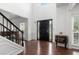 Bright foyer with tall ceilings, hardwood floors, grand entrance, and staircase at 505 Stedford Lane, Duluth, GA 30097