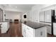 Open-concept kitchen features an island with countertop seating, stainless appliances, and seamless flow to other living spaces at 505 Stedford Lane, Duluth, GA 30097