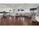 Open concept living room with hardwood floors, and view into modern kitchen at 505 Stedford Lane, Duluth, GA 30097