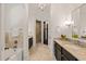 Well-appointed bathroom featuring dual vanity sinks, a soaking tub, and a separate shower at 5140 Long Island Nw Dr, Sandy Springs, GA 30327