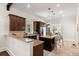 Modern kitchen features granite counters, stainless steel appliances, and a stylish island with seating at 5140 Long Island Nw Dr, Sandy Springs, GA 30327