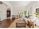 Bright living room with large windows, white walls, and hardwood floors at 5140 Long Island Nw Dr, Sandy Springs, GA 30327