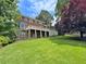 Spacious backyard featuring a large deck, mature trees, and a charming fence line at 10300 Carleigh Ln, Roswell, GA 30076