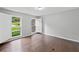 Cozy bedroom with hardwood floors and plantation shutters at 10300 Carleigh Ln, Roswell, GA 30076