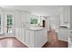 Modern kitchen with white cabinets, granite countertops, and stainless steel appliances at 10300 Carleigh Ln, Roswell, GA 30076