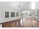 Open-concept living room with plenty of natural light and open access to the kitchen at 10300 Carleigh Ln, Roswell, GA 30076