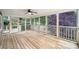 Spacious screened porch with views of the natural beauty in the backyard at 10300 Carleigh Ln, Roswell, GA 30076