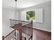 Upper level view of the staircase with a backyard view at 10300 Carleigh Ln, Roswell, GA 30076