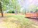 Picture of a large, grassy backyard featuring a wooden fence and a deck at 2190 Gordon Se Cir, Smyrna, GA 30080