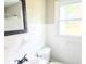 Well-lit bathroom with white subway tiles and modern dark-colored fixtures at 2190 Gordon Se Cir, Smyrna, GA 30080