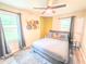 Bright bedroom with large windows, a ceiling fan, and cozy gray carpet and accents at 2190 Gordon Se Cir, Smyrna, GA 30080