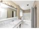 Bright bathroom featuring white tiling, a large vanity, and modern fixtures at 2767 Kathie Ln, Ellenwood, GA 30294