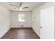 Bedroom with new flooring, a window, and a ceiling fan at 2767 Kathie Ln, Ellenwood, GA 30294