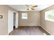 Bedroom with new flooring, a window, and a ceiling fan at 2767 Kathie Ln, Ellenwood, GA 30294