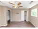 Bedroom featuring new flooring, natural light, and a ceiling fan at 2767 Kathie Ln, Ellenwood, GA 30294
