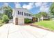 Split-level home with an attached garage, driveway, and well-manicured lawn at 2767 Kathie Ln, Ellenwood, GA 30294