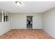 Living room featuring weathered floors, natural light, and columns at 2767 Kathie Ln, Ellenwood, GA 30294