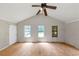 Spacious living room featuring a ceiling fan and three windows at 2767 Kathie Ln, Ellenwood, GA 30294