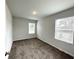 A serene bedroom with neutral walls, plush carpeting, and natural light streaming through the large windows at 3341 Sable Elm Ct, Atlanta, GA 30349