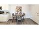 Cozy dining area next to the kitchen featuring a table with four chairs and modern decor at 3341 Sable Elm Ct, Atlanta, GA 30349