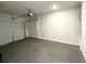 Spacious two-car garage with high ceilings, an automatic door, and ample space for parking and storage at 3341 Sable Elm Ct, Atlanta, GA 30349