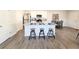 Stylish kitchen featuring white cabinets, stainless steel appliances, granite countertops, and a sociable center island at 3341 Sable Elm Ct, Atlanta, GA 30349