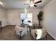 Bright living room with natural light, wood-style flooring, modern furniture, and an adjacent door at 3341 Sable Elm Ct, Atlanta, GA 30349