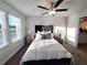 Sunlit main bedroom featuring neutral colors, plush carpeting, and stylish furnishings for a relaxing retreat at 3341 Sable Elm Ct, Atlanta, GA 30349