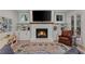Bright living room with a fireplace, built-in shelves, comfortable seating, and stylish decor at 357 Mell Ave # A, Atlanta, GA 30307