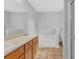 Bright bathroom featuring double sinks, tub, and neutral color palette at 3946 Village Crossing Ln, Ellenwood, GA 30294