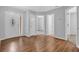 Inviting foyer with a decorative glass front door and wood-look flooring at 3946 Village Crossing Ln, Ellenwood, GA 30294
