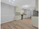 Open concept kitchen with stainless steel appliances and plenty of cabinet space at 3946 Village Crossing Ln, Ellenwood, GA 30294