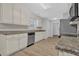 Modern kitchen with granite countertops and stainless steel appliances at 3946 Village Crossing Ln, Ellenwood, GA 30294