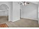 Open living area with vaulted ceilings, neutral walls, and easy access to other rooms at 3946 Village Crossing Ln, Ellenwood, GA 30294