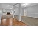 Open-concept living room with fireplace, high ceilings, and seamless flooring at 3946 Village Crossing Ln, Ellenwood, GA 30294