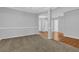 Living room featuring neutral carpet and views of other rooms in the house at 3946 Village Crossing Ln, Ellenwood, GA 30294