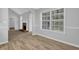 Open living room with fireplace and hardwood floors at 3946 Village Crossing Ln, Ellenwood, GA 30294